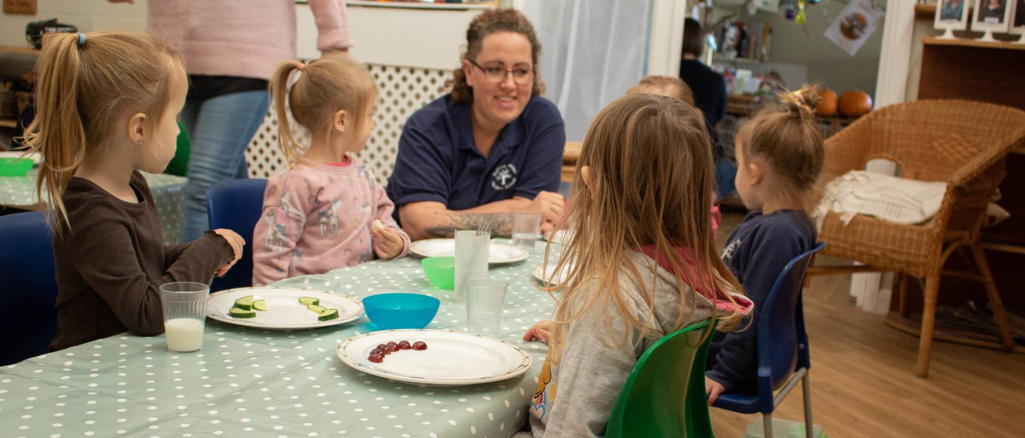 children-seated-around-a-table-at-lunchtime