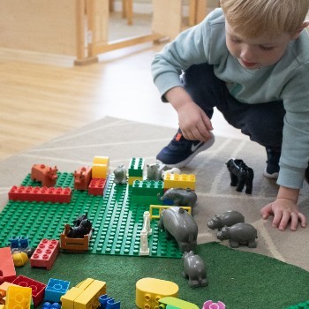 child-plays-with-lego